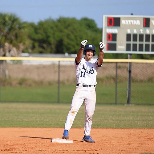 Jacopo Tamburini stands on second base celebrating.